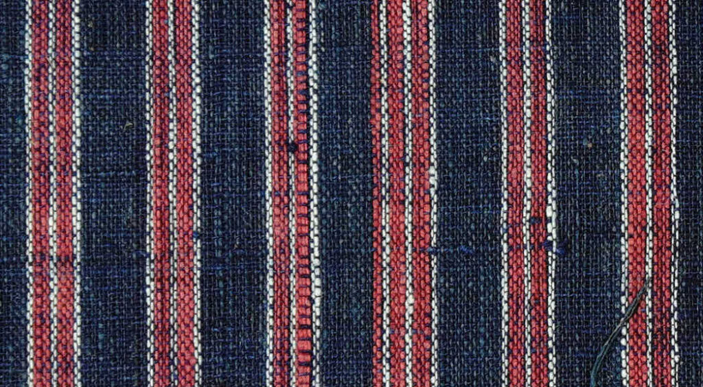 Swatch of red nickanees, East Indian textiles samples, purchased in London, from the collection of the Danish Trade Company for Manufactures.