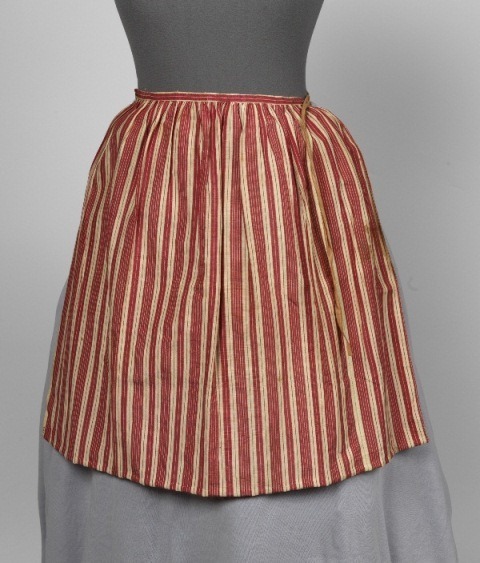 A Girl’s Apron with Red and White Stripes